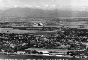 A Pan-Am Clipper flying boat is visible in foreground, and Nielsen Field is in the background to right in this 1939 view.  (Courtesy Lougopal.com)